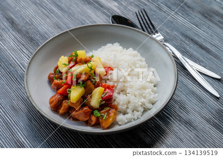 Chicken with pineapple in teriyaki sauce with fried rice. Chicken with pineapple in teriyaki sauce with fried rice. 134139519