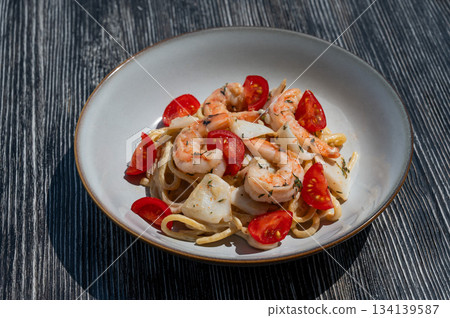 Pasta with shrimp and tomatoes. Pasta with shrimp and tomatoes. 134139587