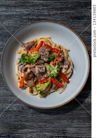 Top view of pasta with beef and broccoli.  134139903