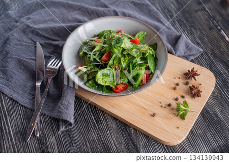 Green salad served in a cafe. Green salad served in a cafe. 134139943
