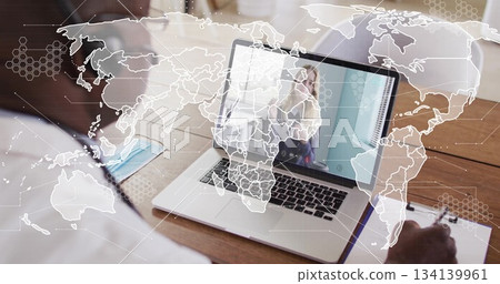 Joining virtual meeting on laptop professional in light shirt at office desk, with pen paper mask 134139961