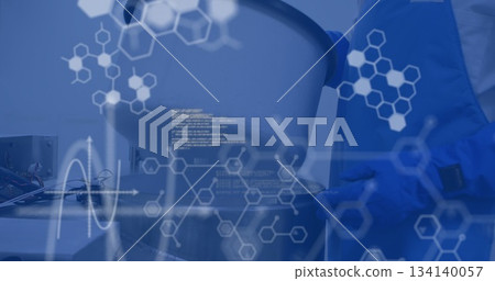 Technician wearing blue coat analyzing mixing vessel in lab, with chemical overlay, copy space Technician wearing blue coat analyzing mixing vessel in lab, with chemical overlay, copy space 134140057