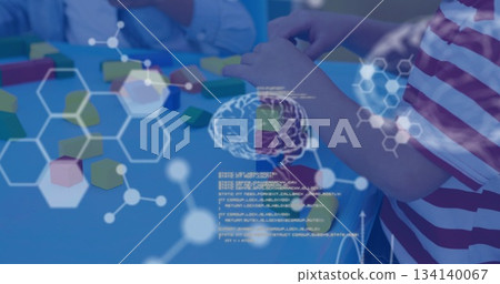Stacking colorful wooden blocks two boys mixing play with network overlays on blue classroom table Stacking colorful wooden blocks two boys mixing play with network overlays on blue classroom table 134140067