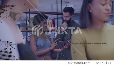 Discussing content colleague showing tablet while peer examining data in office with bookshelves Discussing content colleague showing tablet while peer examining data in office with bookshelves 134140174