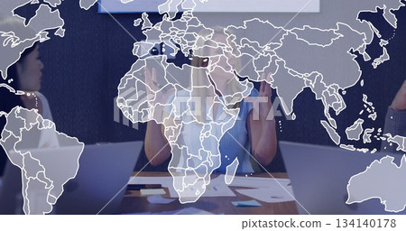 Business team in business attire discussing project at conference table, with laptops and charts Business team in business attire discussing project at conference table, with laptops and charts 134140178