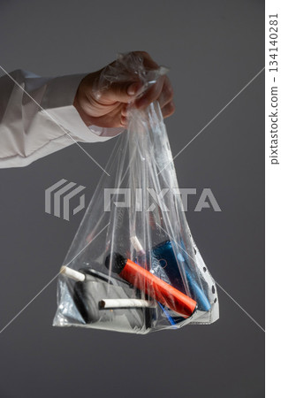 Electronic cigarettes and disposable vapes in a bag.  134140281