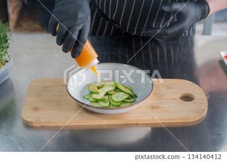 The chef prepares a salad. The chef prepares a salad. 134140412