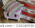 Small pink ottoman chest with pillow. For styling and picnic. On the open veranda 134140596