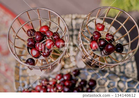 Cherries in large golden dishes Chic serving of dishes. Fruit Cherries in large golden dishes Chic serving of dishes. Fruit 134140612