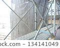 Scaffolding for repair work on the exterior walls of a high-rise apartment building Scaffolding for repair work on the exterior walls of a high-rise apartment building 134141049