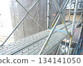 Scaffolding for repair work on the exterior walls of a high-rise apartment building Scaffolding for repair work on the exterior walls of a high-rise apartment building 134141050