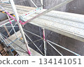 Scaffolding for repair work on the exterior walls of a high-rise apartment building Scaffolding for repair work on the exterior walls of a high-rise apartment building 134141051