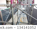 Scaffolding for repair work on the exterior walls of a high-rise apartment building Scaffolding for repair work on the exterior walls of a high-rise apartment building 134141052