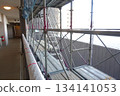 Scaffolding for repair work on the exterior walls of a high-rise apartment building Scaffolding for repair work on the exterior walls of a high-rise apartment building 134141053