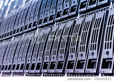 Cluster of data storage hard drives inside server room Cluster of data storage hard drives inside server room 134141413
