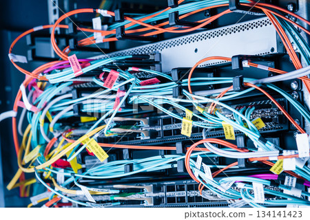 detail of server rack with fiber optic cables attached to front 134141423
