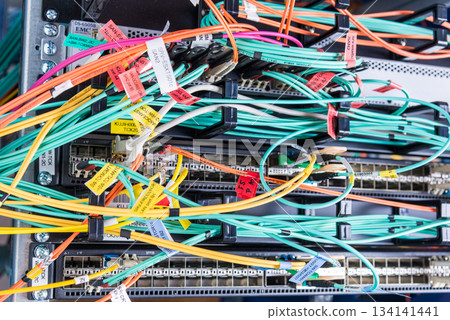 detail of server rack with fiber optic cables attached to front detail of server rack with fiber optic cables attached to front 134141441