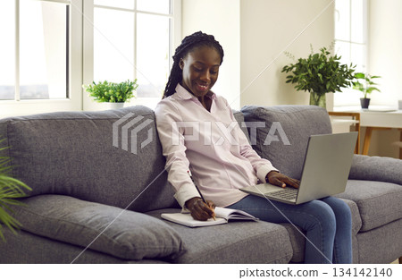 Woman makes notes in diary and writes down daily tasks, secrets, ideas in personal organizer. Woman makes notes in diary and writes down daily tasks, secrets, ideas in personal organizer. 134142140