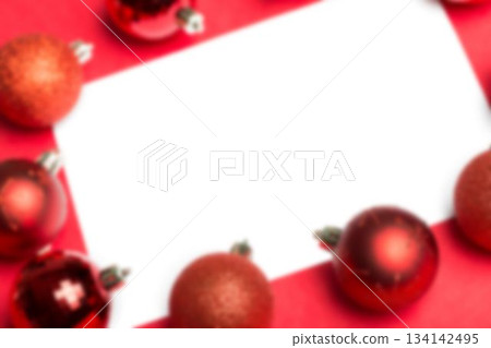 White page surrounded by christmas baubles 134142495