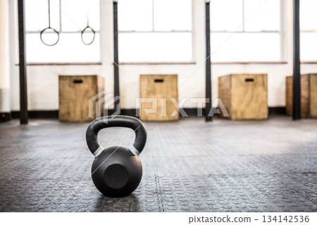 Kettlebells on flooring at gym Kettlebells on flooring at gym 134142536