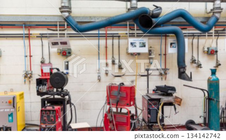 Flat design workshop is showing welding machines and fume hoses with colored pipes and gas tank 134142742