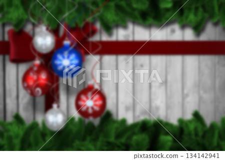 Christmas baubles hanging over wood 134142941