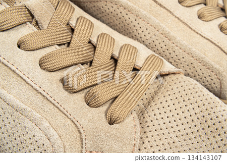 Brown suede lace-up shoes close-up Brown suede lace-up shoes close-up 134143107