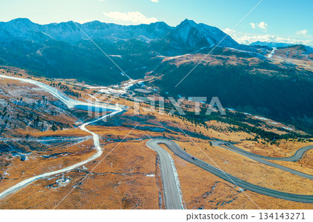 Mountain landscape on a sunny autumn day. View of highway in Pyrenees mountains, Andorra, Europe Mountain landscape on a sunny autumn day. View of highway in Pyrenees mountains, Andorra, Europe 134143271