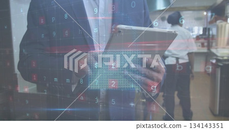 Inspecting suited manager holding tablet in commercial kitchen, with floating holographic data Inspecting suited manager holding tablet in commercial kitchen, with floating holographic data 134143351