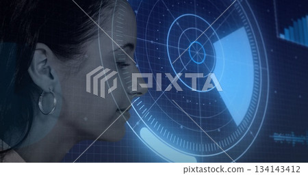 Analyzing female technician scanning holographic interface on grid panel in lab, copy space 134143412