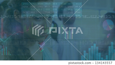Analyzing Asian woman reviewing tables and charts on digital displays in office analytics Analyzing Asian woman reviewing tables and charts on digital displays in office analytics 134143557