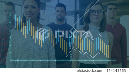 Team of five business professionals analyzing data in office lobby, with translucent chart overlay Team of five business professionals analyzing data in office lobby, with translucent chart overlay 134143563