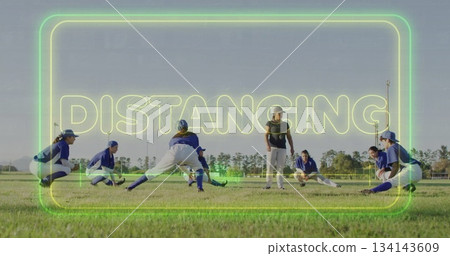 Stretching softball players wearing jerseys and baseball caps on field, with neon DISTANCING text Stretching softball players wearing jerseys and baseball caps on field, with neon DISTANCING text 134143609