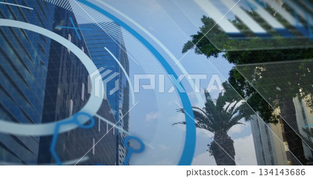 Displaying digital HUD overlay floating over skyline downtown, with glass skyscraper and palm trees Displaying digital HUD overlay floating over skyline downtown, with glass skyscraper and palm trees 134143686