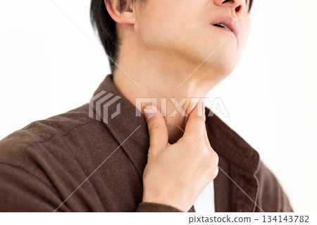 Middle-aged man suffering from sore throat Middle-aged man suffering from sore throat 134143782