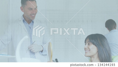 Leaning dentist guiding patient inspecting teeth at bright dental clinic, with explorer and mirror 134144193