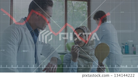 Leaning male dentist consulting headscarf patient in dental clinic, with mirror and graph overlays 134144222