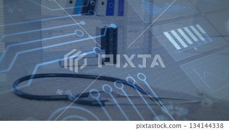 Highlighting stethoscope lying on desk at clinic, with binders and bar chart and interface graphics 134144338