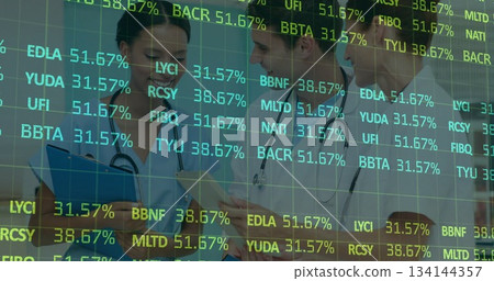 Reviewing notes, digital grid tickers, three medical experts in scrubs, coats consulting in hallway 134144357