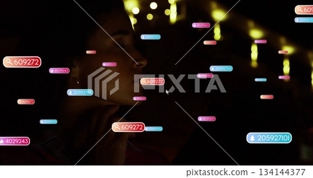 Woman reclining in profile in room lit by string lights, with floating UI icons, copy space 134144377