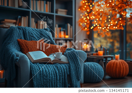This image captures a cozy reading nook beside a rain-streaked window, perfect for relaxation on a rainy day. 134145171