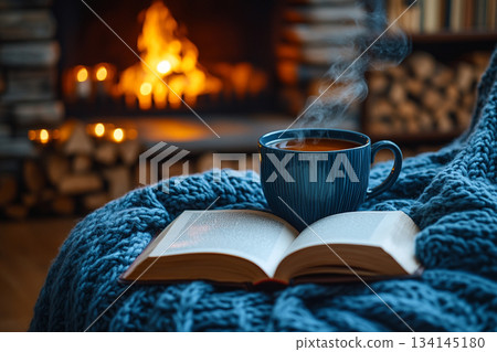 This image captures a cozy reading nook beside a rain-streaked window, perfect for relaxation on a rainy day. This image captures a cozy reading nook beside a rain-streaked window, perfect for relaxation on a rainy day. 134145180