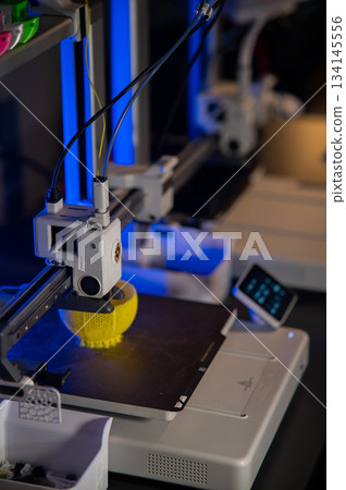 A student man print prototype on 3D printer 134145556