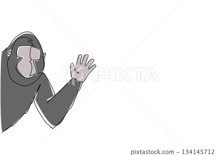 Continuous line drawing of a gorilla waving hand behind the wall, built with a nature concept and the theme animal waving hand, ideal for International Primate Day artistic celebration design. 134145712