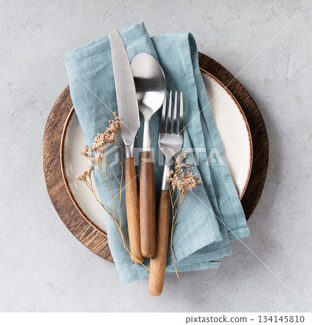 Rustic Table Setting with Blue Linen 134145810