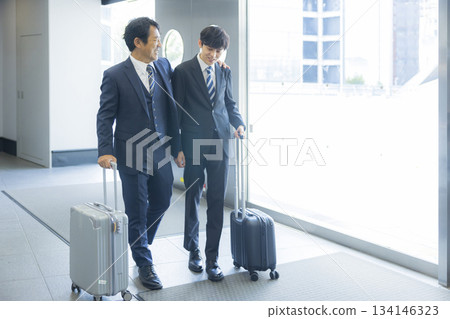 Businessman walking in an office building Businessman walking in an office building 134146323