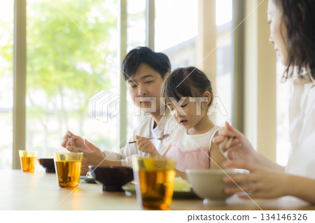 A happy family at the dinner table A happy family at the dinner table 134146326