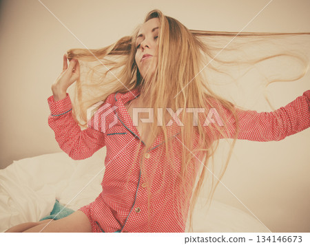 Awaken woman stretching body after sleeping Awaken woman stretching body after sleeping 134146673