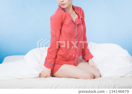 Funny woman wearing pajamas and bathing cap Funny woman wearing pajamas and bathing cap 134146679