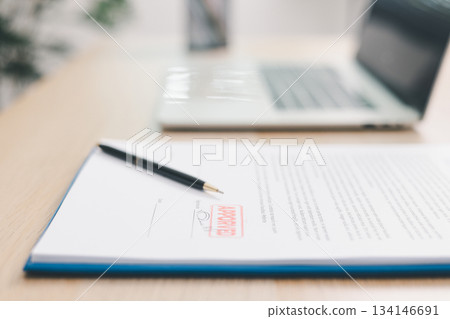 Close up approved stamp on signed document with pen on desk, concept of successful business contract, legal authorization, agreement approval or financial verification process. approved stamp Close up approved stamp on signed document with pen on desk, concept of successful business contract, legal authorization, agreement approval or financial verification process. approved stamp 134146691